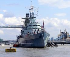 photo of a warship on the river Thames