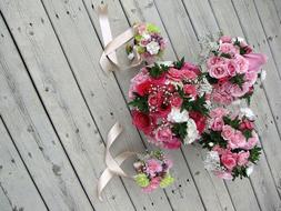 romantic wedding bouquets on a wooden floor