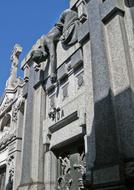 photo of the sculpture on the stone crypt