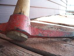 Red Axe on wooden bars