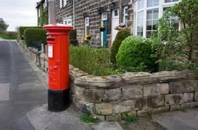 vintage red mailbox at house, uk, England