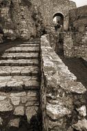 black and white photo of steps of a destroyed castle in Slovakia