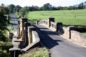 arched stone bridge over the river