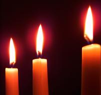 three Candles burning at Darkness