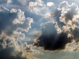 sun light, blue sky and dark clouds