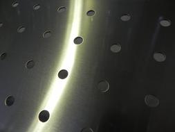 Steel construction with holes in light