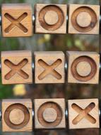 wooden cubes with noughts and crosses
