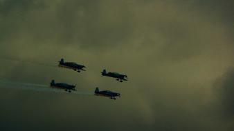 Formation Flying, four aircrafts at cloudy sky