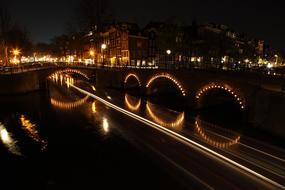 beautiful highlight of a stone bridge in Amsterdam