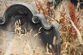 old headstone in the grass