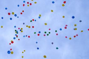 multi-colored balloons in the blue sky