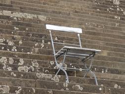 folding chair on stone steps