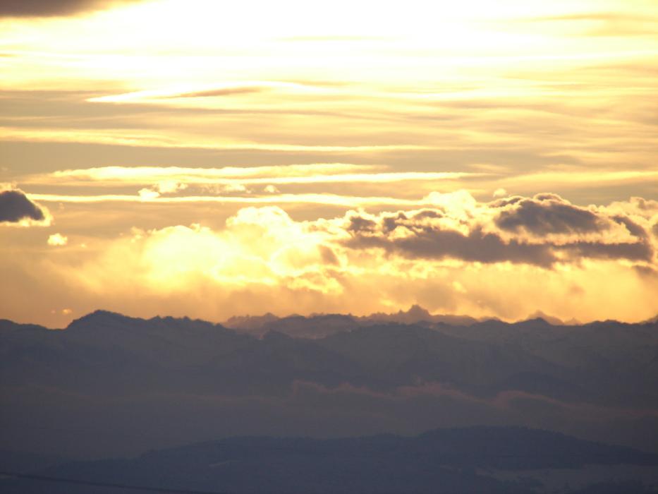 clouds over alpine mountains in winter