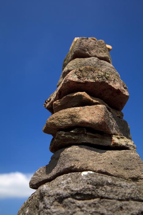 stacked wild stones at sky