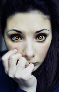 photo portrait of a girl with vampire eyes