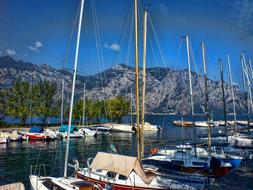Colorful boats on the beautiful Gard Lake, in Malcesine, Italy