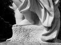 black and white photo of foot sculpture