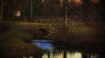 bridge in park at dusk, germany, brandenburg