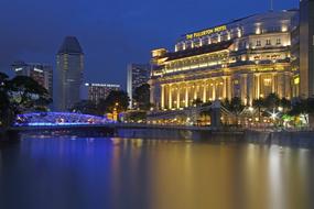 Beautiful cityscape of Singapore with Fullerton Hotel, with colorful lights, at night