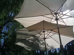 two white Umbrellas, protection from Sun