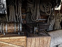 Wooden kegs, boxes and ropes for the sailing ship