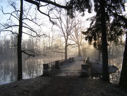 bridge over the pond in the park in the morning