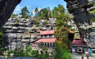 Beautiful and colorful inn, among the trees and rocks, in Czech Republic