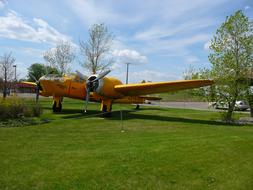 Yellow Two Engine Propeller aircraft