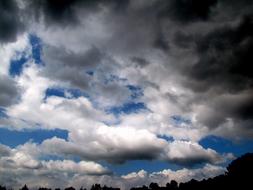 hurricane clouds over dark silhouettes