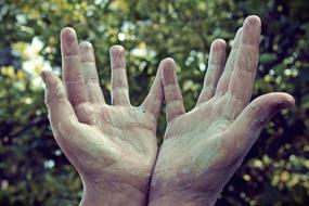 photo of fingers and palms in paint