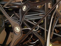 Close-up of the shiny coat hangers, with the icons, with the elephants