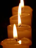 candles with flames in a row close-up