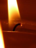 Close-up of of the burning wick, of a candle