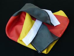 rumpled Flag of Germany at Black background