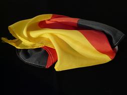 rumpled germany flag on black background