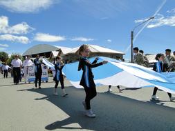 large flag of Argentina in parade