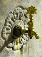 golden faucet in the fountain