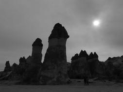 fairy chimneys rock formations at full moon night, Black And white, turkey, cappadocia