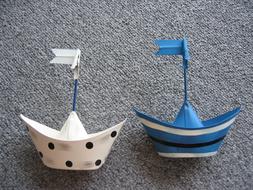 white and blue paper boat