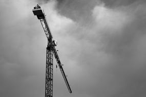 Crane construction in grey sky