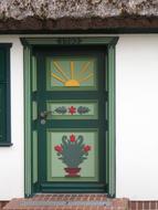 traditional pattern on the door of a house on the shore of the Baltic Sea