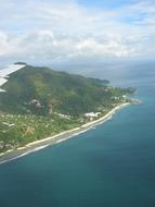 view from the plane to the island on a sunny day