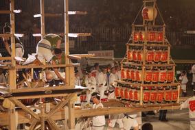 men with tower on nebuta festival, japan