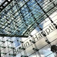 Shiny Berlin Central station in Germany, with the reflections of the sky, with the clouds