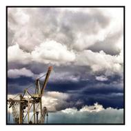 harbor cranes under the clouds in hamburg