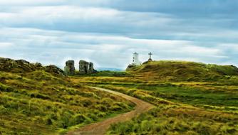 Beautiful landscape of the colorful and beautiful hills in Wales, under the sky with clouds