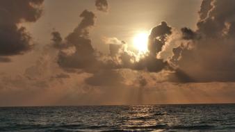 Beautiful waterscape with ripple, at colorful sunset in the clouds
