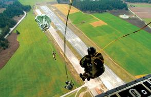 paratrooper jumps out of the plane