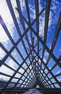 Drying rack with the wooden frame, in Norway, under the blue sky with clouds