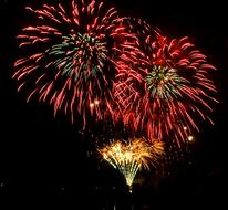 Beautiful and colorful, bright fireworks in the black sky with stars